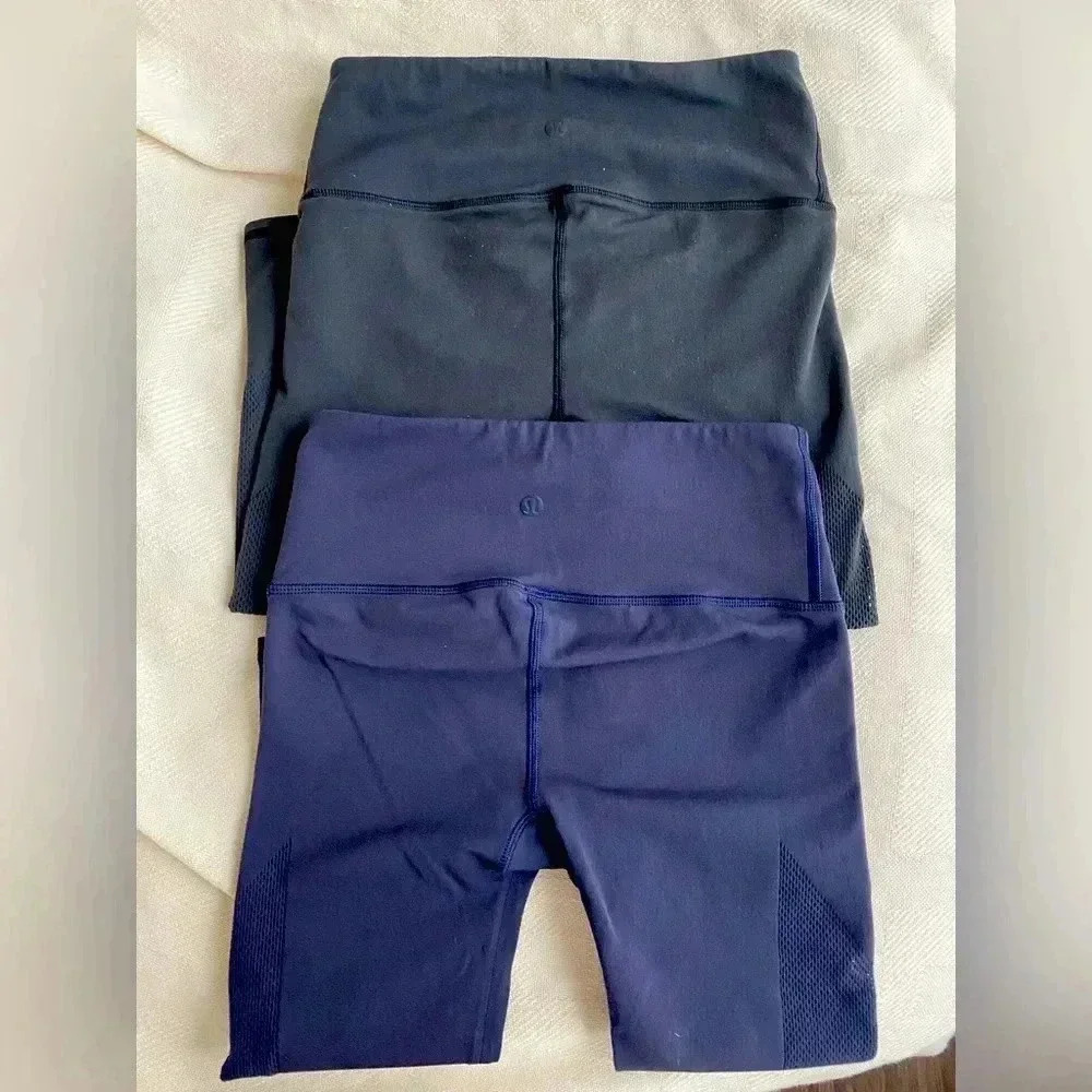 Lululemon set of cropped leggings with mesh on side 
Sz small navy blue & black